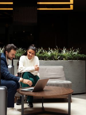 full-shot-people-working-laptop